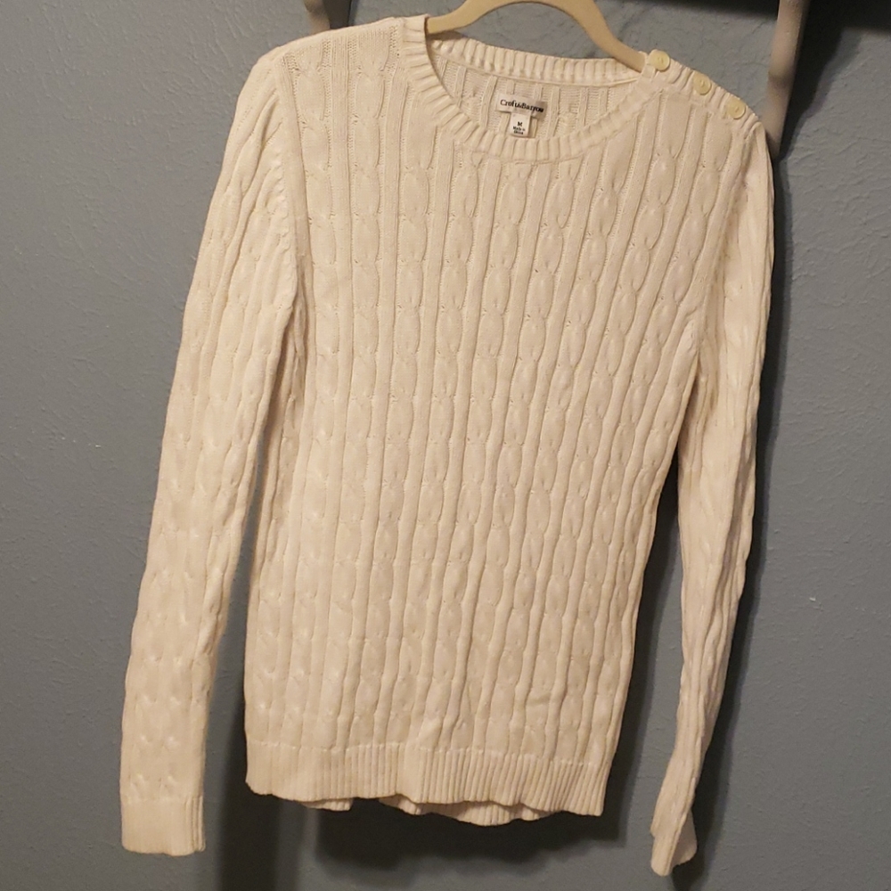 Ivory cable knit sweater button at left shoulder